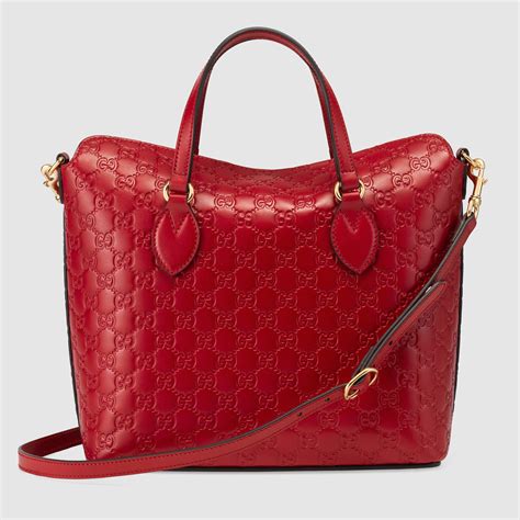 red Gucci purse with logo